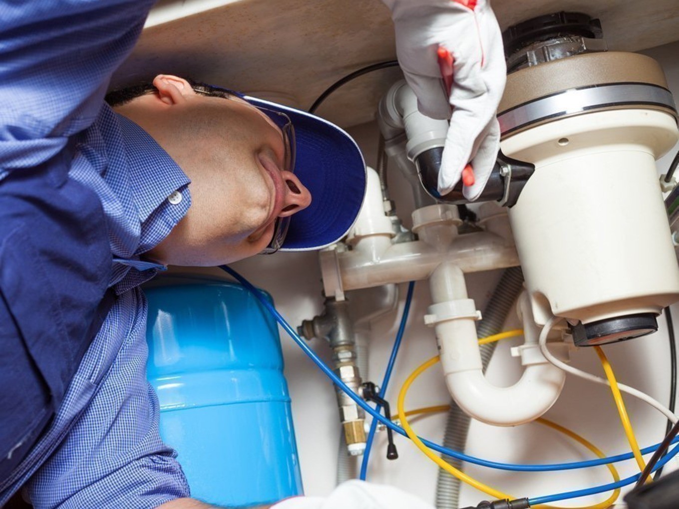 Who installs а garbage disposal plumber or electrician note