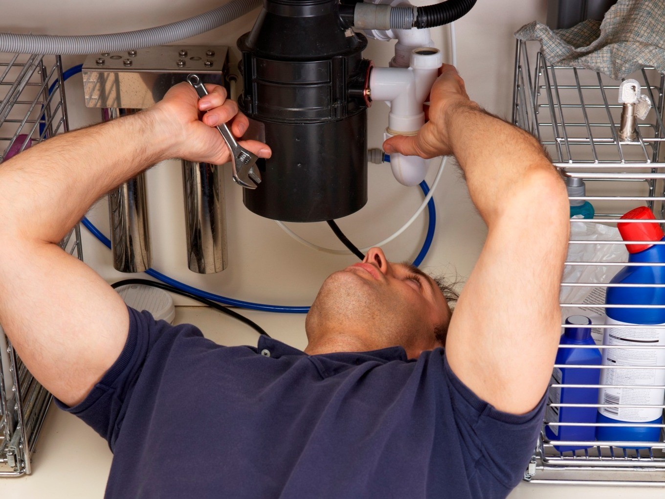 Who installs а garbage disposal plumber or electrician note